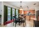 Eat-in kitchen with light wood cabinets, granite countertops, and island at 2399 Parkside Glen Dr, Apopka, FL 32712