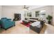 Open living area featuring a large sectional sofa and a flat-screen TV at 2399 Parkside Glen Dr, Apopka, FL 32712