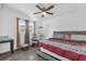 Bedroom featuring a queen-sized bed, ceiling fan, and a window at 4535 Arch St, Orlando, FL 32808