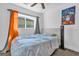 Bedroom featuring a ceiling fan and a window with curtains at 4535 Arch St, Orlando, FL 32808