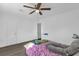 Bedroom featuring a window, a ceiling fan, and hardwood flooring at 4535 Arch St, Orlando, FL 32808