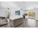 Open-concept living area featuring hardwood floors and sliding doors to the outdoors at 4535 Arch St, Orlando, FL 32808