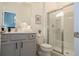 Bathroom featuring granite countertop, a modern vanity, a glass-enclosed shower, and tiled floors at 6240 Sand Skipper Rd, Orlando, FL 32821