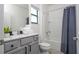 The bathroom features a modern vanity with a light countertop and a shower with a tub at 6240 Sand Skipper Rd, Orlando, FL 32821