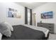 Relaxing bedroom with a soft bed, sleek dresser, and a wall-mounted television for entertainment at 6240 Sand Skipper Rd, Orlando, FL 32821