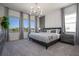 This bedroom features a gray interior, large windows, and modern lighting at 6240 Sand Skipper Rd, Orlando, FL 32821