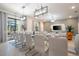 Elegant dining room featuring a large table with seating for many and stylish lighting, perfect for entertaining at 6240 Sand Skipper Rd, Orlando, FL 32821