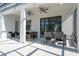 Outdoor patio with ceiling fans and dining furniture provides shaded entertaining at 6240 Sand Skipper Rd, Orlando, FL 32821