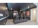 Home theater with tiered seating, a large screen, and blacked-out walls for a true cinematic experience at 6240 Sand Skipper Rd, Orlando, FL 32821