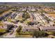 Scenic aerial shot of a charming townhome community, highlighted by green spaces and tree-lined streets at 13228 Daniels Landing Cir, Winter Garden, FL 34787