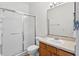 Bathroom featuring a shower with sliding doors, toilet and vanity at 13228 Daniels Landing Cir, Winter Garden, FL 34787