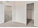 Carpeted bedroom with view to the landing and access to a walk-in closet at 13228 Daniels Landing Cir, Winter Garden, FL 34787