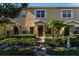 Charming townhome featuring manicured landscaping, neutral colors, and a covered entryway to welcome you home at 13228 Daniels Landing Cir, Winter Garden, FL 34787
