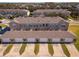 Rear aerial view of a multi-Gathering building with multiple garages and backyard common space at 13228 Daniels Landing Cir, Winter Garden, FL 34787