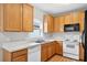 Kitchen features natural wood cabinetry and stainless steel appliances at 13228 Daniels Landing Cir, Winter Garden, FL 34787
