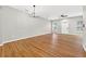Large living room with wood flooring, neutral walls, and views of the front door at 13228 Daniels Landing Cir, Winter Garden, FL 34787