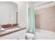 Clean bathroom with a tub and shower combination at 571 Drop Shot Dr, Davenport, FL 33896