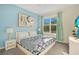 Bright bedroom with a king-size bed and a large window at 571 Drop Shot Dr, Davenport, FL 33896