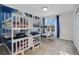 Bedroom with two bunk beds and large window at 571 Drop Shot Dr, Davenport, FL 33896