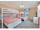 Bedroom with a bunk bed and a window at 571 Drop Shot Dr, Davenport, FL 33896
