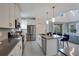 Modern kitchen with stainless steel appliances and island at 571 Drop Shot Dr, Davenport, FL 33896