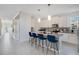 Modern kitchen with white cabinets and stainless steel appliances at 571 Drop Shot Dr, Davenport, FL 33896