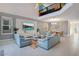 Spacious living room with vaulted ceiling and large TV at 571 Drop Shot Dr, Davenport, FL 33896