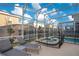 Relaxing pool and spa with lounge chairs at 571 Drop Shot Dr, Davenport, FL 33896