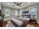Main bedroom with hardwood floors and large windows at 728 Palm Dr, Orlando, FL 32803