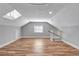 Large bonus room with hardwood floors and skylights at 728 Palm Dr, Orlando, FL 32803