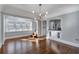 Dining room with hardwood floors and a modern chandelier at 728 Palm Dr, Orlando, FL 32803