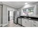 Modern kitchen features stainless steel appliances and white shaker cabinets at 728 Palm Dr, Orlando, FL 32803