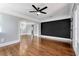Living room with hardwood floors and a large accent wall at 728 Palm Dr, Orlando, FL 32803