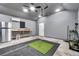 Workshop with workbench, mini-fridge, and golf simulator at 728 Palm Dr, Orlando, FL 32803