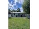 Charming single-story home featuring a well-maintained lawn, cute shrubs, and white privacy fence at 110 Oleander Ave, Auburndale, FL 33823