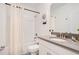 Bathroom with tub shower combo and gray vanity at 1179 Kingsbarn St, Davenport, FL 33896