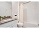 Clean bathroom, featuring a tub and gray vanity at 1179 Kingsbarn St, Davenport, FL 33896