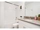 Bathroom with tub shower combo and gray vanity at 1179 Kingsbarn St, Davenport, FL 33896