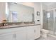 Bathroom with double vanity and walk-in shower at 1179 Kingsbarn St, Davenport, FL 33896
