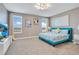 Bedroom with king bed and teal headboard at 1179 Kingsbarn St, Davenport, FL 33896