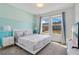 Bright bedroom with king-size bed and large windows at 1179 Kingsbarn St, Davenport, FL 33896