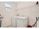 Laundry room with washer, dryer, and shelving at 1179 Kingsbarn St, Davenport, FL 33896
