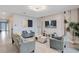 Spacious living room with gray sofas, a large TV, and stylish decor at 1179 Kingsbarn St, Davenport, FL 33896