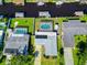 An aerial view of a home with a pool and multiple boat docks along a canal at 136 Reef Rd, South Daytona, FL 32119
