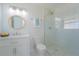 Modern bathroom featuring glass enclosed shower, updated fixtures, and stylish tile accents at 136 Reef Rd, South Daytona, FL 32119