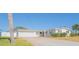 Charming single-story home featuring a two-car garage, well-maintained landscaping and a long private driveway at 136 Reef Rd, South Daytona, FL 32119