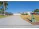 Charming home exterior with a well-maintained yard, long driveway, and decorative mailbox at 136 Reef Rd, South Daytona, FL 32119