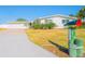 Charming single-story home featuring a well-manicured lawn and a unique fish mailbox at 136 Reef Rd, South Daytona, FL 32119