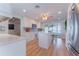 Bright kitchen with stainless steel appliances, island, and breakfast bar seating at 136 Reef Rd, South Daytona, FL 32119