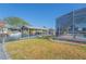 Picturesque waterfront property featuring boat dock, lush greenery, and a covered swimming pool at 136 Reef Rd, South Daytona, FL 32119